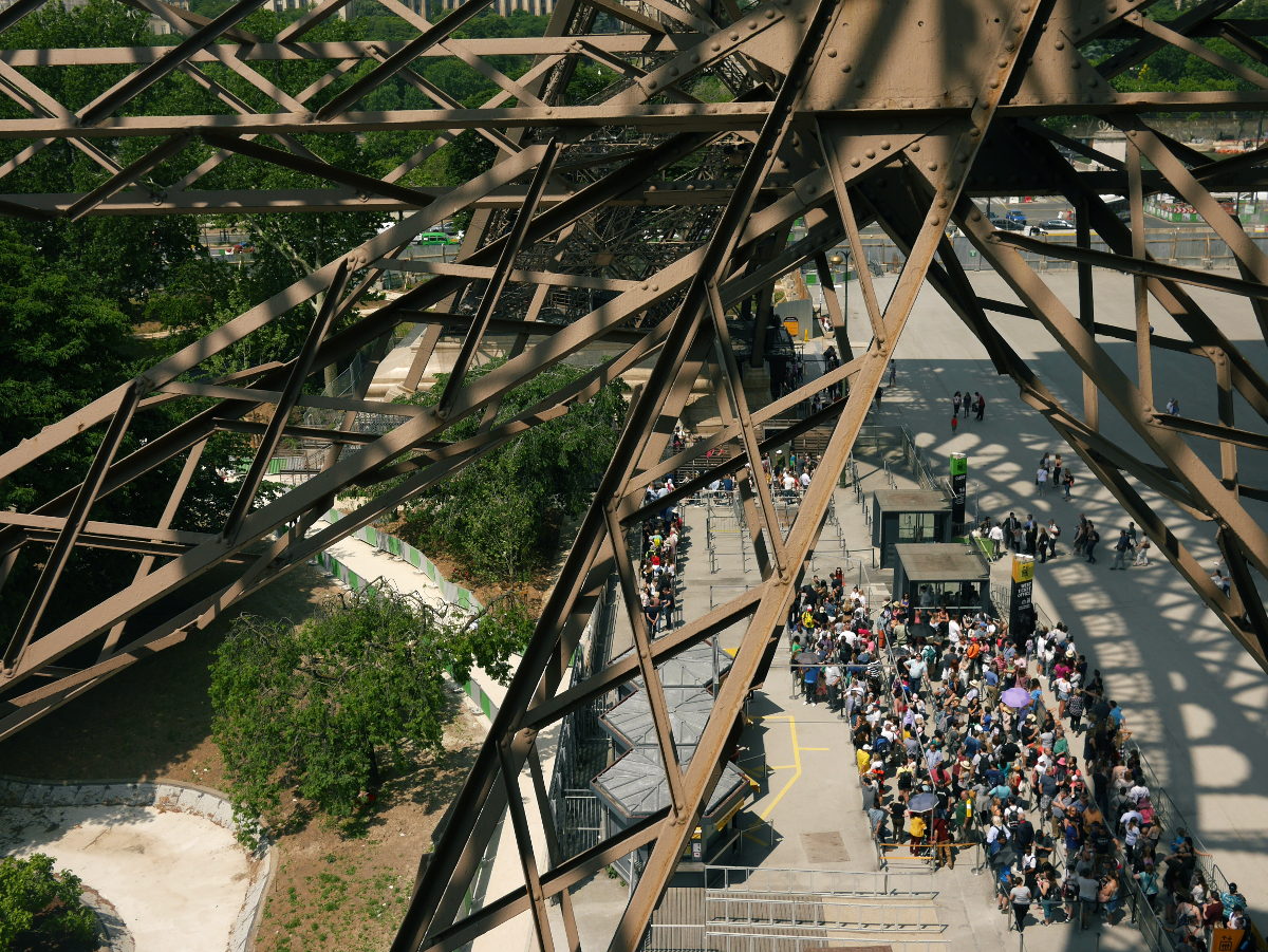 View from Eiffel Tower stairs, looking down on the queue for the lift